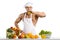 Man bodybuilder cook, cooking freshly squeezed juice and vegetables salad