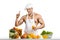 Man bodybuilder cook, cooking freshly squeezed juice and vegetables salad