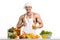 Man bodybuilder cook, cooking freshly squeezed juice and vegetables salad