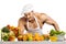 Man bodybuilder cook, cooking freshly squeezed juice and vegetables salad