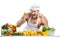 Man bodybuilder in white toque blanche and cook protective apron