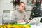 Man bookkeeper doing paperwork in Christmas decorated office