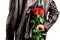 Man with a bouquet of red roses behind his back. Elegant man holding red rose flowers in hand