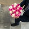 man with bouquet on the stairs