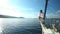 Man on the bow of sailing boat on Mediterranean sea.