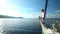 Man on the bow of sailing boat on Mediterranean sea.