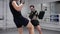 Man boxer kicking boxing pads by legs at personal training with coach. Fighter training hit to kick pads on boxing ring