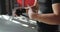 Man boxer unwrapping hands after fighting or training in gym, closeup hands.