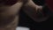 Man with Boxing gloves Boxing in front of the camera close up. Close-up of young man punching. Boxer performing uppercut