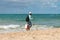 Man with a brazier selling queijo coalho grilled cheese at Itapua beach - popular beach snack