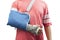 Man with broken bone arm using cast and sling for treatment