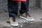 Man with brown checkered shoes with rainbow before Fendi fashion show, Milan Fashion Week street style on