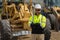 Man builder near excavator. Builder worker with excavator. Builder in helmet. Worker in hardhat. Portrait mechanical