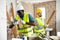 Man builder using electric hammer in construction site