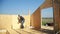 A man building a house. foam polystyrene. blocks made of plywood and insulation. housekeeping cottage. measurement tape