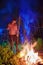 Man burning brushwood on fire, seasonal cleaning of the countryside area, village lifestyle