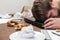 Man with burnout sleeping on his dirty desk