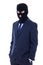 Man in business suit and black burglar mask with hand extended t