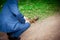 Man in a business suit feeds a squirrel