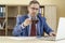 A man in a business suit holds a cup of hot coffee in his hands. Morning of an office worker. Boss Close-up