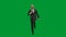 Man in business suit with horse head mask on green studio background. Businessman walking, bouncing and dancing. Concept