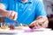 Man buttering a slice of wholewheat bread