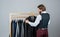 Man buy clothes fashion store menswear suit tuxedo, luxurious wardrobe concept
