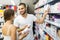 Man buying cosmetical cream in the shopping mall