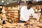 Man buying groats in supermarket