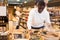 Man buying groats in supermarket