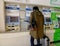 A man buying ticket at the train station in Tokyo, Japan