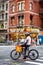 A man with bycicle on street near times sqaure in Manhattan , New york city