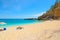 Man in Cala Biriola on a clear day