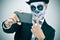 Man with calaveras makeup taking a selfie