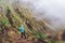 Man with camera taking a foto of gorgeous canyon valley on the path from Xo-Xo Valley. Santo Antao Island, Cape Verde