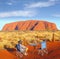 Man camping chair watching sunset Uluru Ayers Rock, Australia