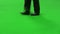 Man with cane isolated on green background