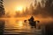 A man in canoe on a foggy tranquil lake with forest at sunrise. Winter Autumn seasonal concept.