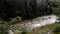 Man on canoe kayaking on rapid mountain river.