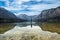 Man on a canoe on a mountain lake