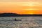 Man canoeing on sunset