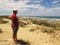 Man at Cape Recife nature reserve at Angola bay in Port Elizabeth on Sunshine Coast, South Africa