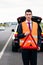 Man with car breakdown erecting warning triangle