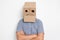 a man with a cardboard box on his head, a sad smiley