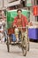 Man on cargo bike in a narrow alley, Xian, China