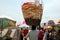 Man carries a basket with flatbread