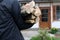 A man carries firewood for heating the house