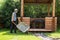 Man carries gravel for paths in wheelbarrow