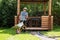 Man carries gravel for paths in wheelbarrow