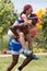 Man Carries Woman Piggyback Style At Atlanta Field Day Games